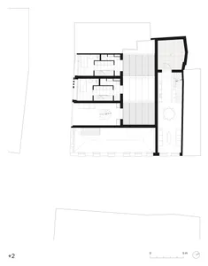 Floor plan of a modern residential building showing various rooms and sections, including living areas, bedrooms, and a kitch