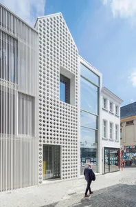 Modern building with white metal facade and large windows