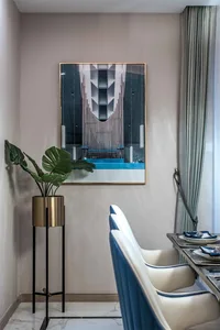 A Modern Dining Room with Metallic and Glass Background Artwork