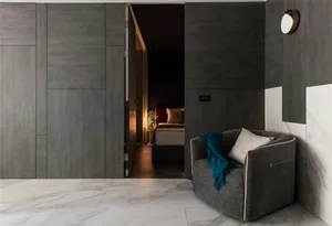 Modern living room featuring metallic cabinet and marble flooring