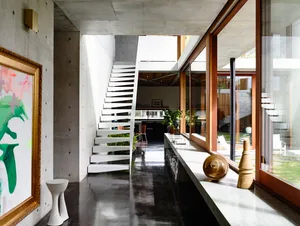 Modern interior with concrete walls and open space in a contemporary home.