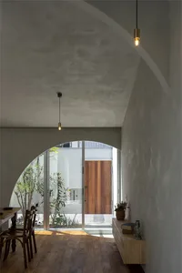 Modern minimalist interior with concrete walls and floor.