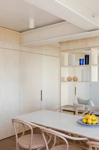 Modern kitchen with marble countertops and wooden cabinets