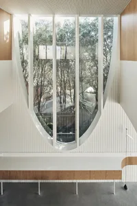 Modern interior design featuring large glass windows