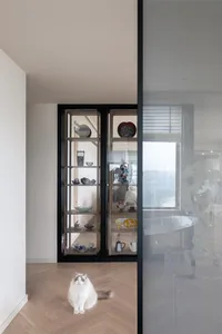 A contemporary residential space showcasing wood and glass elements.