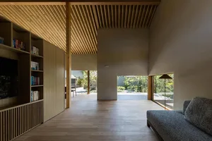 Modern living room featuring wooden elements and a comfortable seating area.
