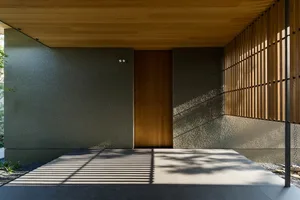 A modern metal-clad exterior facade with wood paneling and a sleek, minimalist design.