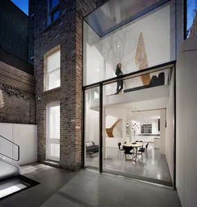 A modern residential interior featuring mixed materials and design.