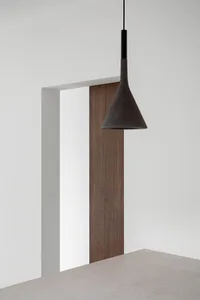 A minimalist interior design featuring a wooden panel.