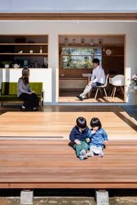A modern residential space featuring wooden flooring and a minimalist design.