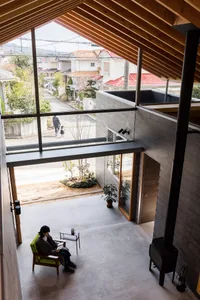 A modern living room with concrete flooring and minimalist design.
