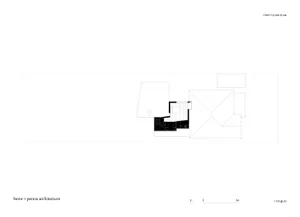 A first-floor architectural plan with a central staircase and rooms arranged around it.