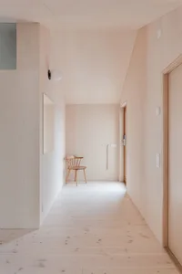 A minimalist interior featuring wood walls and flooring.