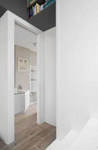 Minimalist home interior with white walls and wooden floors