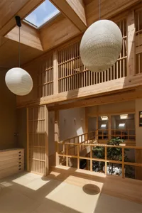 A minimalist residential interior featuring wooden materials and modern design.