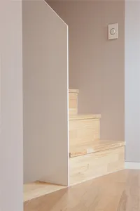 Modern interior staircase made of light-colored wood