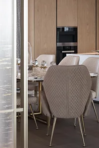 Modern marble dining room with elegant chairs and table centerpiece.