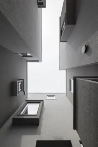 Modern architectural design featuring minimalist style building interiors with concrete materials.