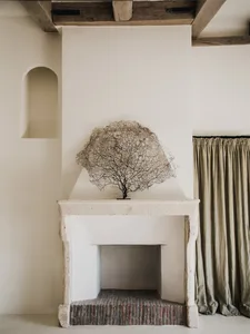A modern interior with a stone fireplace.