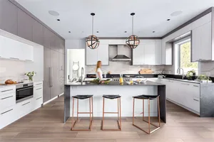 Modern kitchen with concrete, marble countertops, and stainless steel appliances
