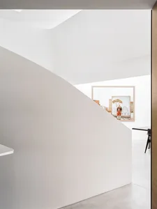 A modern interior space with concrete walls and minimalist design.