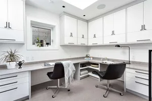 A modern home office featuring concrete and steel finishes.
