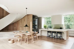A modern interior space featuring wooden elements and concrete textures.
