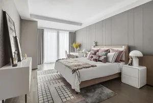 Modern minimalist bedroom with light-colored furniture, soft textiles, and contemporary design elements.
