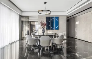 A modern dining room with marble flooring and furniture.