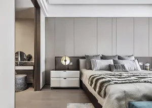Modern bedroom with neutral tones and minimalist design.