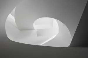 A modern white interior with concrete elements.