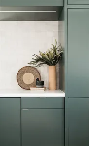 Industrial-style metal bar counter with concrete top and bar stools.