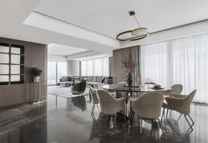 A modern dining room with marble flooring, fabric chairs, and wooden elements.