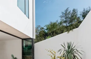 Modern house with concrete and glass exterior.