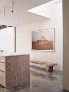Modern kitchen with concrete countertop and wooden island
