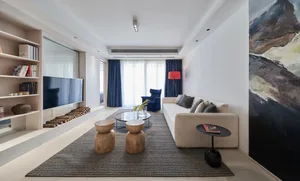 Modern minimalist living room featuring a white sofa with wooden stools, a black side table, and a rug. Blue curtains and a r