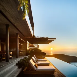 Modular furniture on a modern patio with a scenic sunset view.