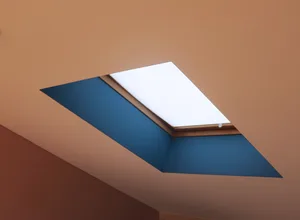 Glass skylight window on a ceiling, providing natural light.