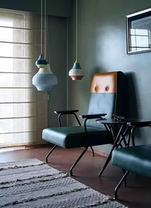 Modern living room featuring leather and metal lounge chairs.