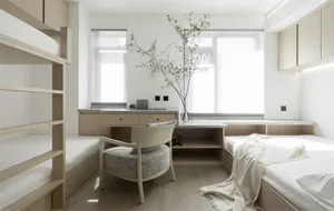 A minimalist bedroom featuring modern materials and furniture.