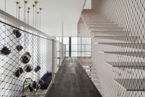 Interior design featuring minimalist style and metal netting.