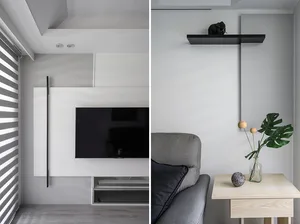 Modern living room featuring a minimalist design with white shades and a sleek, grey sofa.