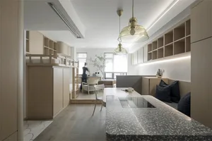 Contemporary minimalist living area featuring sleek wooden and glass furniture, marble countertops, and ample natural light.