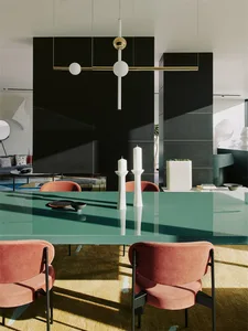 Modern dining room featuring a sleek glass table with pink upholstered chairs, white candles, and minimalist decor.