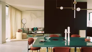 Modern living and dining room with contemporary furniture and design elements.