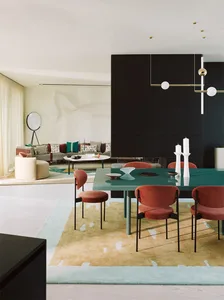Modern living room and dining area with contemporary furniture and colorful accents.