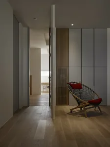 A modern living space featuring wooden furniture and gray elements.