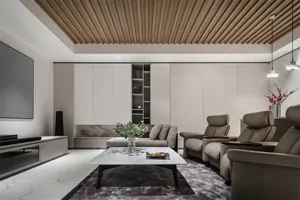 Modern minimalist living room featuring marble coffee table and leather recliners.