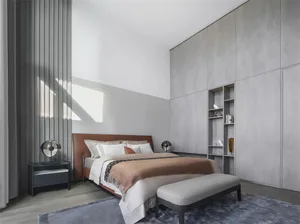 A modern bedroom with a wooden bed and furniture. Light-colored wooden floors and a large window with vertical blinds allow n