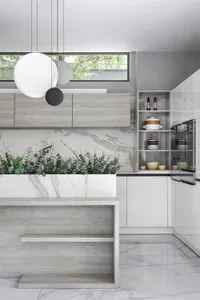 Modern kitchen featuring marble countertops and flooring.